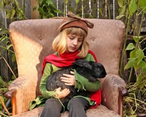 girl on chair with rabbit